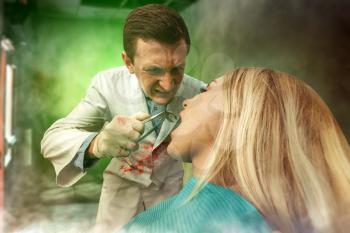 Mad bloodstained dentist extracting a tooth in woman, strange smoke is in the air
