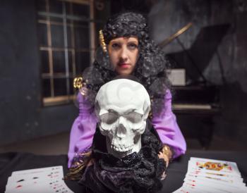Sorceress practises witchcraft using the skull