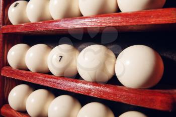 Billiard balls on the shelves close up