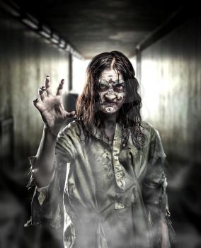 Horror zombie in a dark corridor. Halloween.