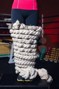 Close up of woman legs bound with rope