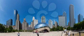Chicago, Illinois, USA - June 14, 2016. Cloud Gate sculpture in Millenium park. One of the most unique and interesting sculptures. Author Anish Kapoor. Panorama cityscape