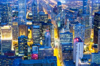 Skyscraper buildings in steel, concrete and glass, night view, Chicago, Illinois USA