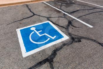 Handicapped symbol painted on a parking spot.