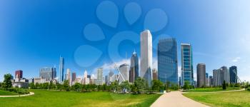 Green meadow on cityscape background, Chicago, Illinois USA
