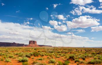 Scenic sandstones and blue cloudy sky at Monument Valley National Tribal Park, Navajo, Utah USA