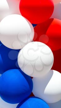 Close up of tricolor balloons. Red, white and blue balloons background.