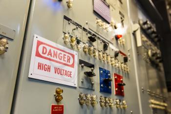 Military ship high voltage control panel. Danger, high voltage sign on battleship