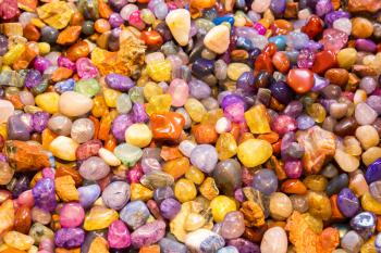 Jewelry stones are the favorite tourist souvenirs. Colorful stones on souvenir bazaar.