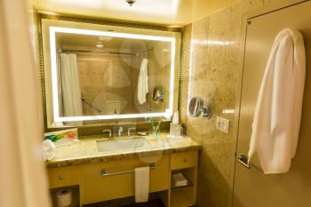 Luxury Interior of hotel bathroom or toilet with worm lighted mirror.