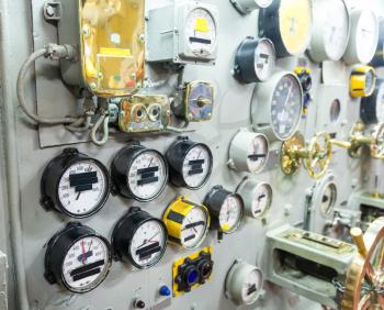 Marine museum exhibition on military ship includes gauges and control equipment.