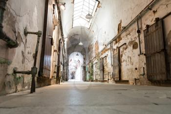 Jail hallway with locked doors. Inside prison museum.