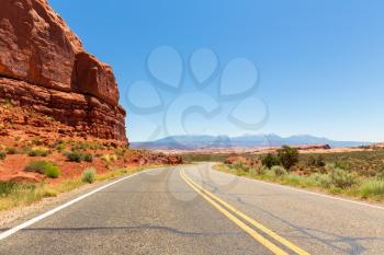 Desert road landscape with blue sky on background