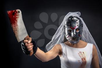 Bride maniac in hockey mask with bloody knife on black background