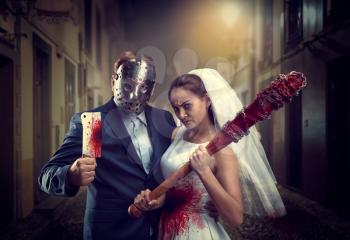 Maniac couple with bloody bat and meat cleaver in night city. Groom in hockey mask