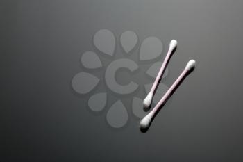 Two cotton buds isolated on black background closeup