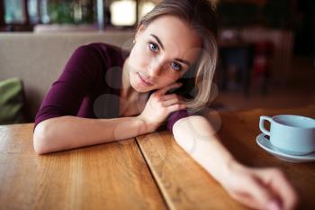 Beauty woman in cafe. Young girl waiting in restaurant.