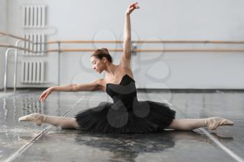 Female ballet dancer posing on rehearsal in class. Ballerina dance