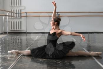 Female ballet dancer posing on rehearsal in class. Ballerina dance