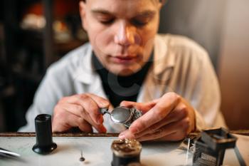 Watchmaker repair old clocks gear closeup