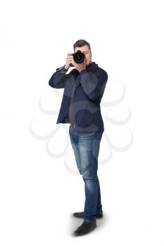 Portrait of male photographer with digital camera, front view, white background
