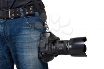 Male photographer legs with belt holding gigital camera with professional lens on white background. Photo business concept