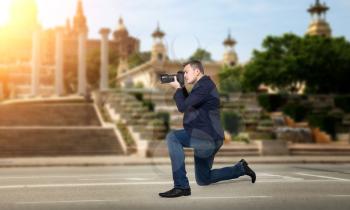Professional photographer takes pictures of sights on digital camera