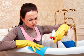 Woman from cleaning servisce sitting in bath. Housekeeping concept