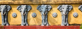 Wall with elephant sculptures in buddha temple, Ceylon attractions, unesco heritage. Asia culture, bubbhism religion