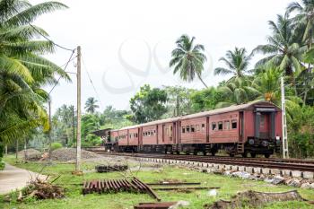 Train station and old locomotive, railway road of Sri Lanka. Ceylon tropical landscape