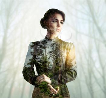 Dress and body of young woman with green forest texture, double exposure effect. Blur trees on background
