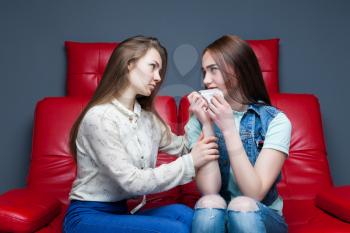 Girl calms her upset girlfriend, female friendship. Women secrets