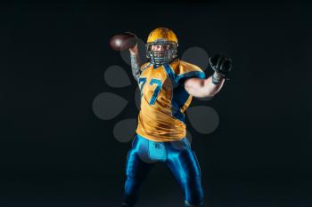 American football player, national league, black background. Contact sport