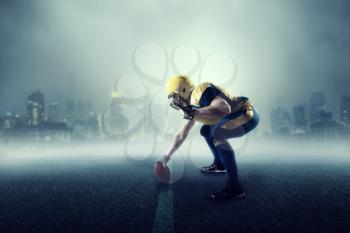 American football player with ball, cityscape on background. National league