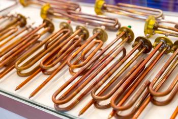 New copper heating elements for water boilers, closeup. Heaters for washing machine
