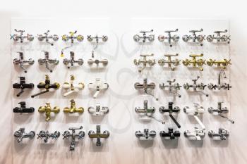 New chrome showers and faucets in plumbing shop, nobody. Sanitary equipment