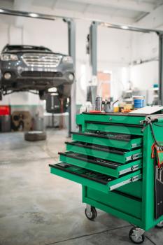 Car service tool box with pull-out shelves, professional instrument. Vehicle repairman equipment