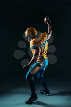 American football player with ball in hand, contact sport