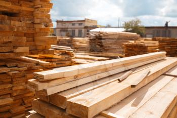 Boards on timber mill warehouse outdoor, nobody, lumber industry, carpentry. Wood processing on factory, forest sawing in lumberyard, sawmill