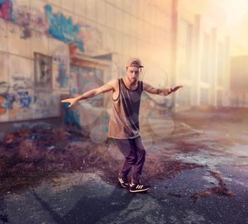 Male rapper dance on the street, trendy lifestyle. Modern urban dancing style