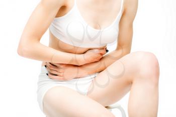 Abdominal pain, female person with stomach problem, white background. Woman in white lingerie, medical advertising or concept