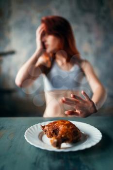 Skinny woman refuses to eat, absence of appetite. Fat or calories burning concept. Weight loss, anorexia