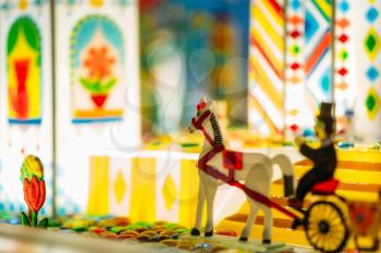 Handmade sugar caramel horse and wagon in showcase of candy store closeup, nobody. Treats for children. Sweet fantasy world