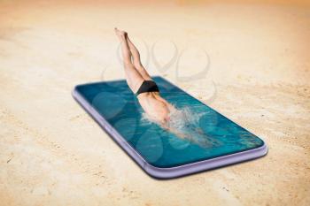 Swimmer diving into the pool is made from large phone screen. Always be in touch or online addiction concept, social addicted people. Scaling effect