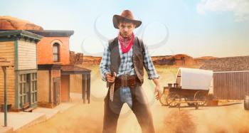 Cowboy with revolver, front view, gunfight in texas country, western. Vintage male person with gun, wild west lifestyle