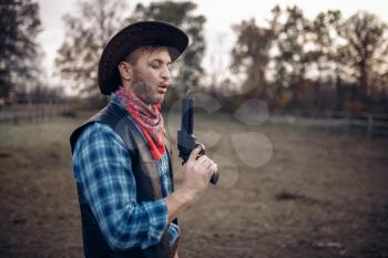 Cowboy with revolver wins gunfight, lucky strike on texas ranch, western. Vintage male person with gun, wild west adventure