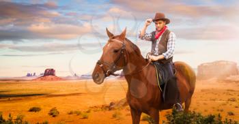 Cowboy riding a horse in desert valley, western. Vintage male person on horseback, wild west adventure 