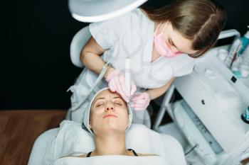 Rejuvenation procedure, getting rid of wrinkles, cosmetology clinic. Facial skincare in spa salon, health care