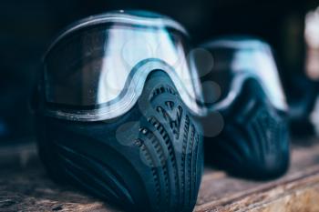 Paintball mask with glasses closeup, nobody. Extreme game protection equipment, sport ammunition
