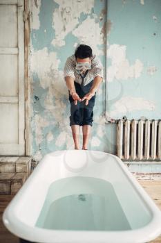 Funny businessman in flippers dives into the bathtub. Business fortune concept